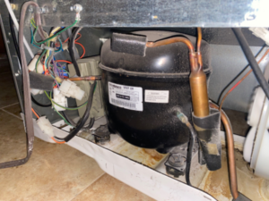 Refrigerator compressors, like the one shown here, are less susceptible to surge damage than other components, such as control boards. 